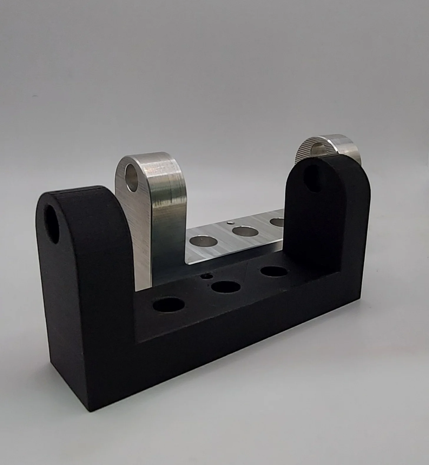 3D printed Onyx workholding prototype alongside its machined aluminium equivalent, validate before you commit